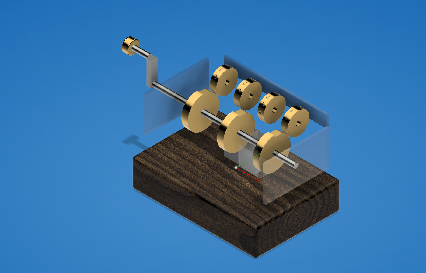 Figure 2 — The four register drums on their shaft, seen through the acrylic side and front panels with the enclosure walls hidden. The crank and its brass knob are at the left of this view.
