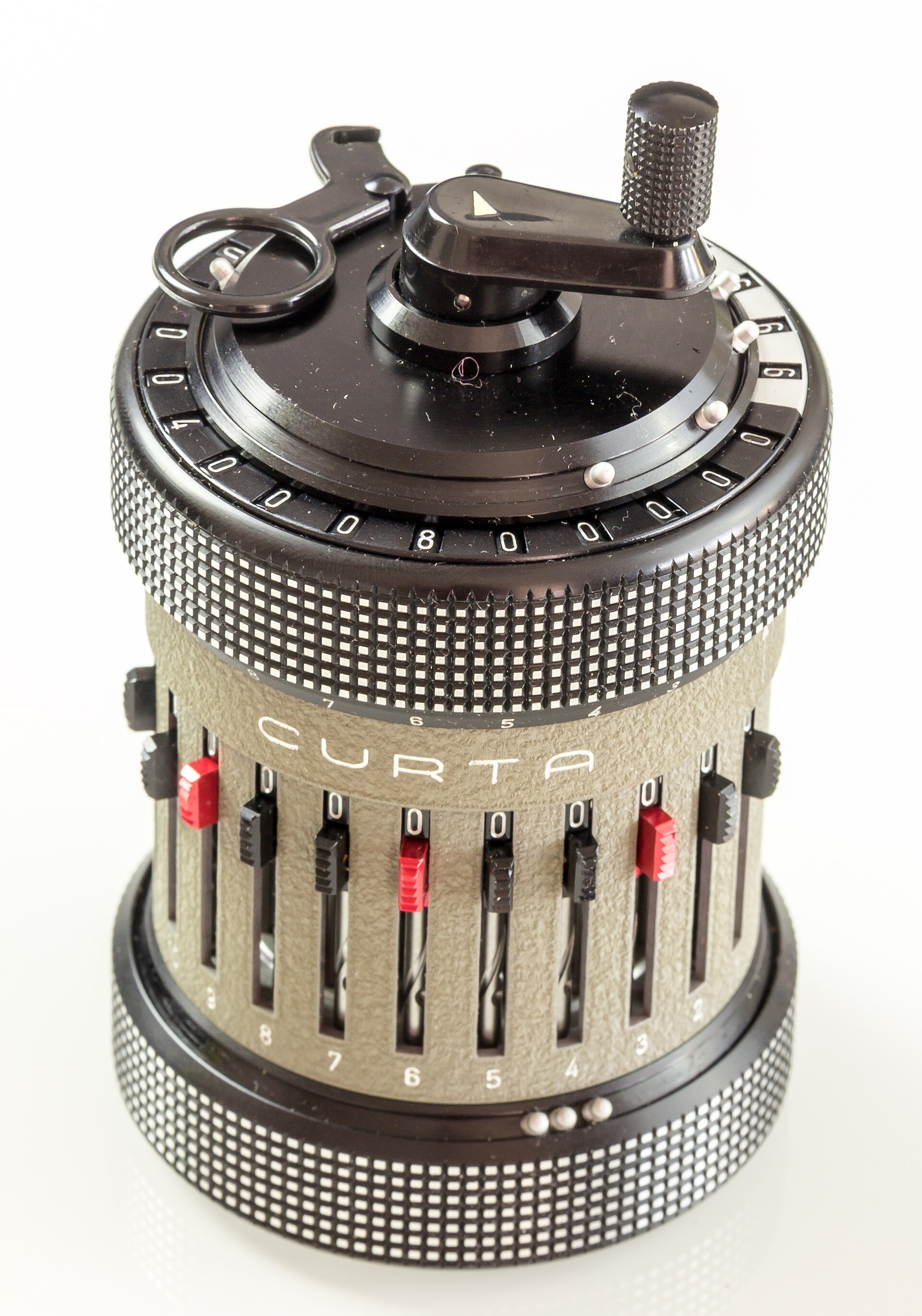 Figure 2 — A Type II from above: the black result ring outside, the white counter ring inside it, the carriage-position scale around the rim, and the crank at the centre.
