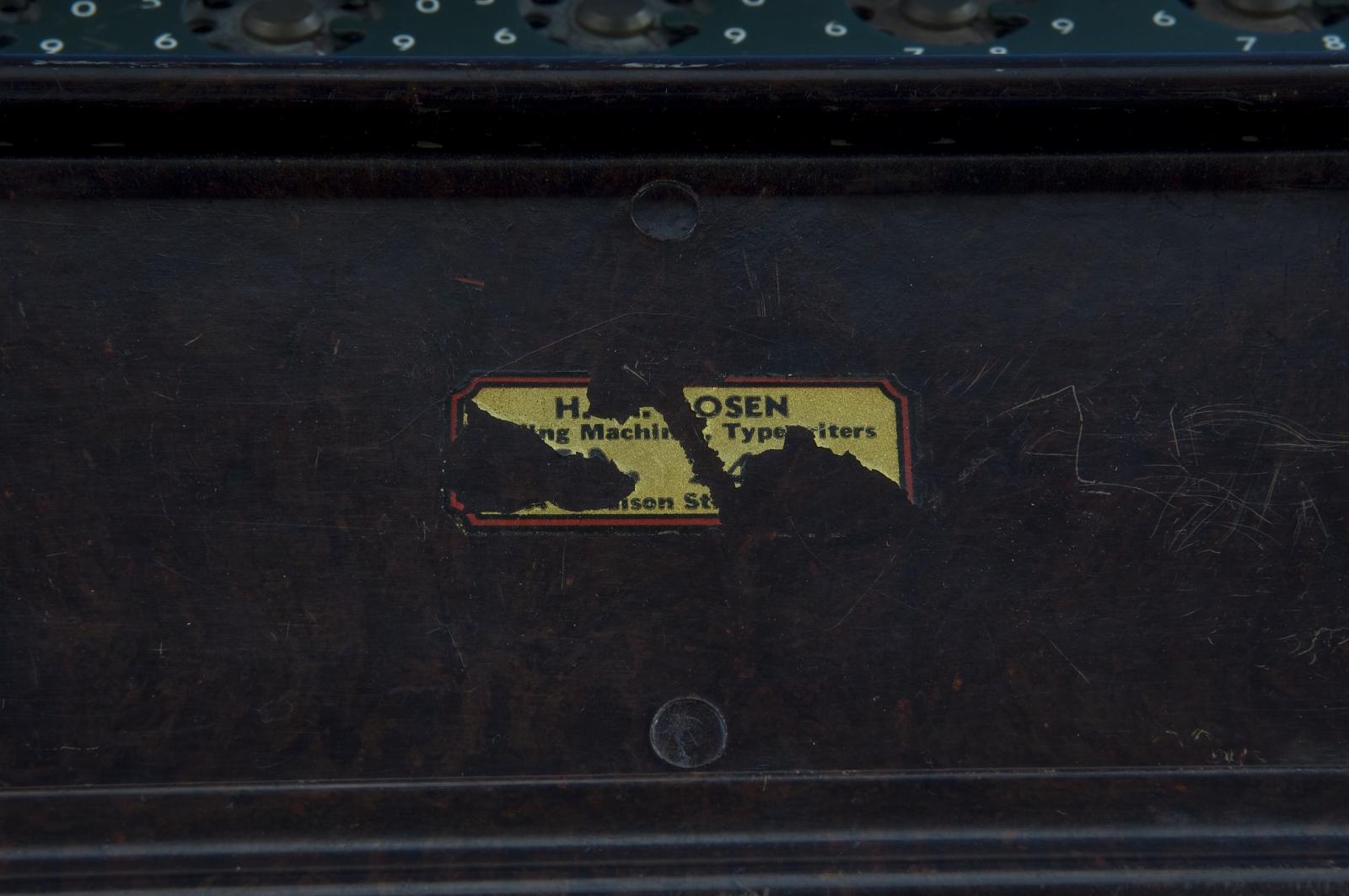Figure 17 — A dealer's label (adding machines and typewriters) under the stand of the Smithsonian machine. Labels like this can say where and when a machine was first sold.