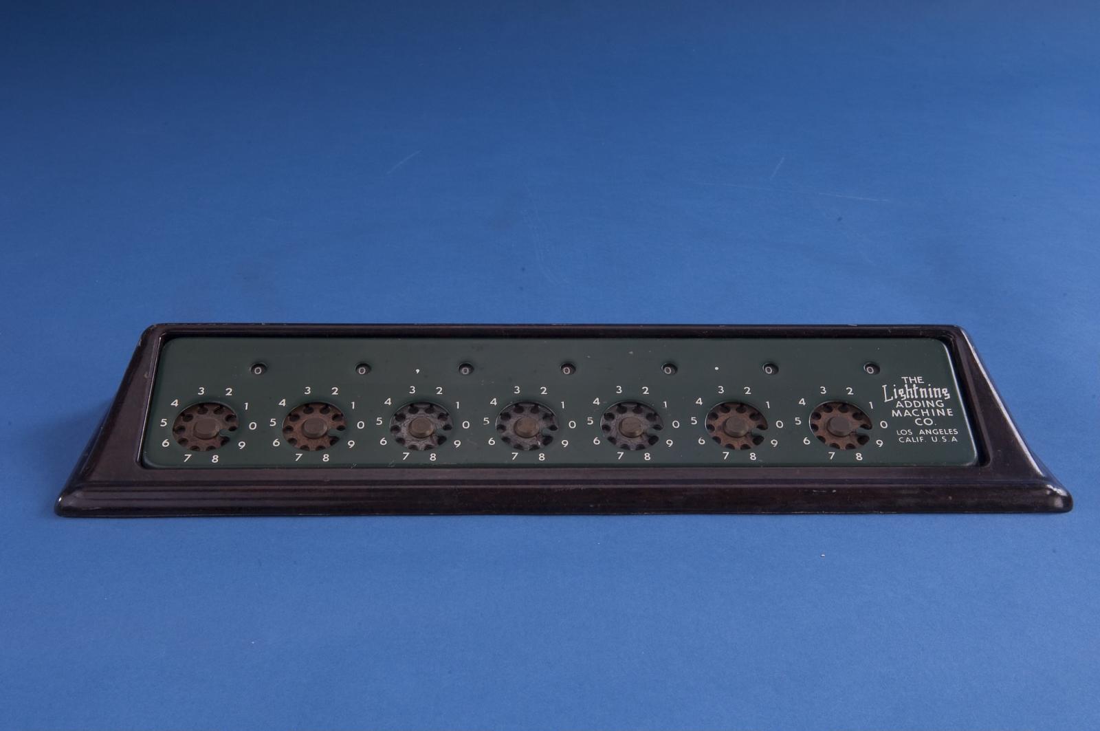 Figure 15 — The Smithsonian's green Lightning, the same model as mine: clearing lever, green face, brown Bakelite stand. The museum dates it to 1948.