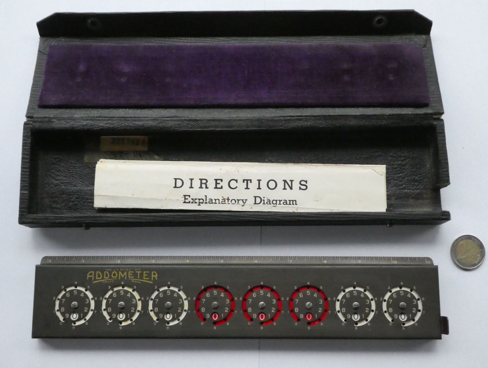 Figure 6 — An Addometer in its fitted case with the "Directions — Explanatory Diagram" sheet.