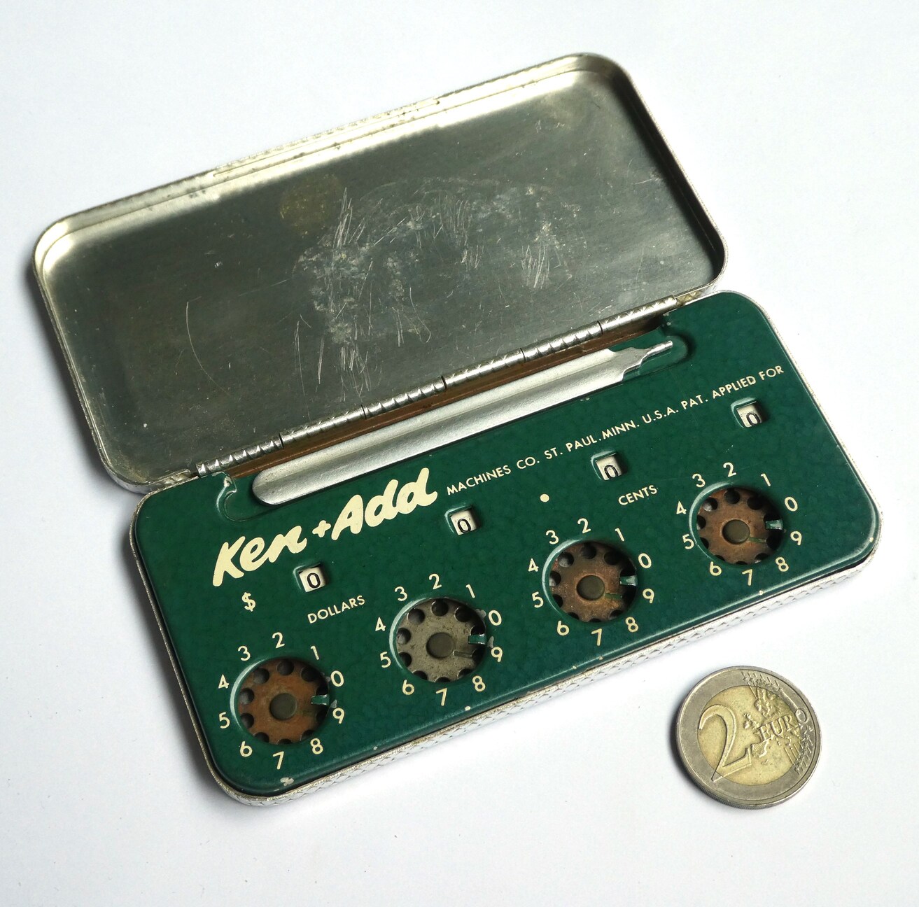 Figure 14 — The Ken+Add, St Paul, Minnesota: a four-dial adder with Lightning-type works in a hinged tin with its stylus.