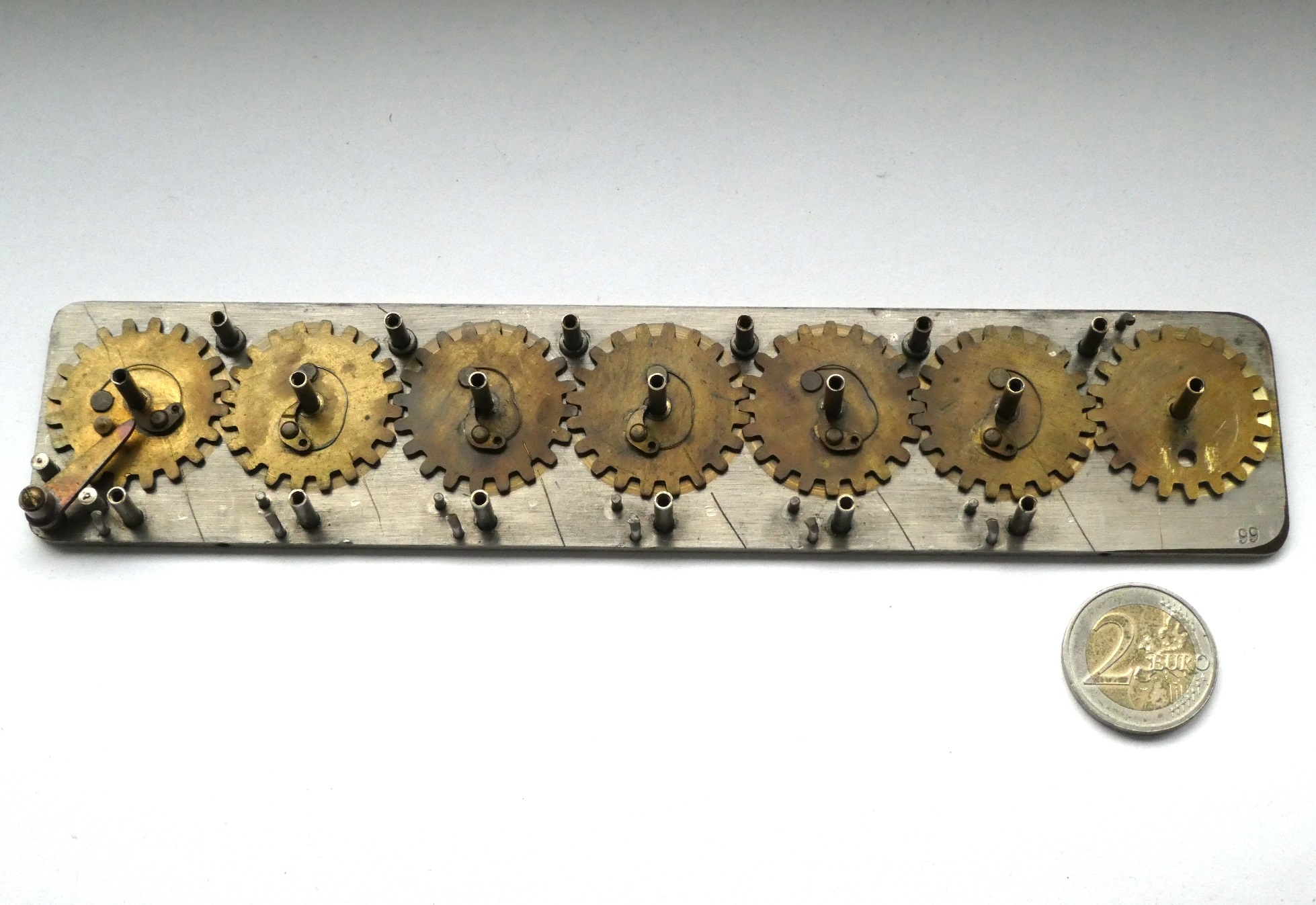 Figure 4 — Inside a Calcumeter: the row of geared stylus wheels on their base plate, the kind of view a Lightning owner would see with the top plate off, though the Lightning's wheels are arranged differently.