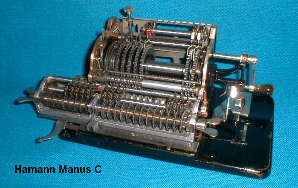 Figure 19 — A Manus model C demonstration machine, serial 2695, with its housing cut away so that the drum, the carriage and the crank gear can be seen working. Its serial number puts it among the same first-v…