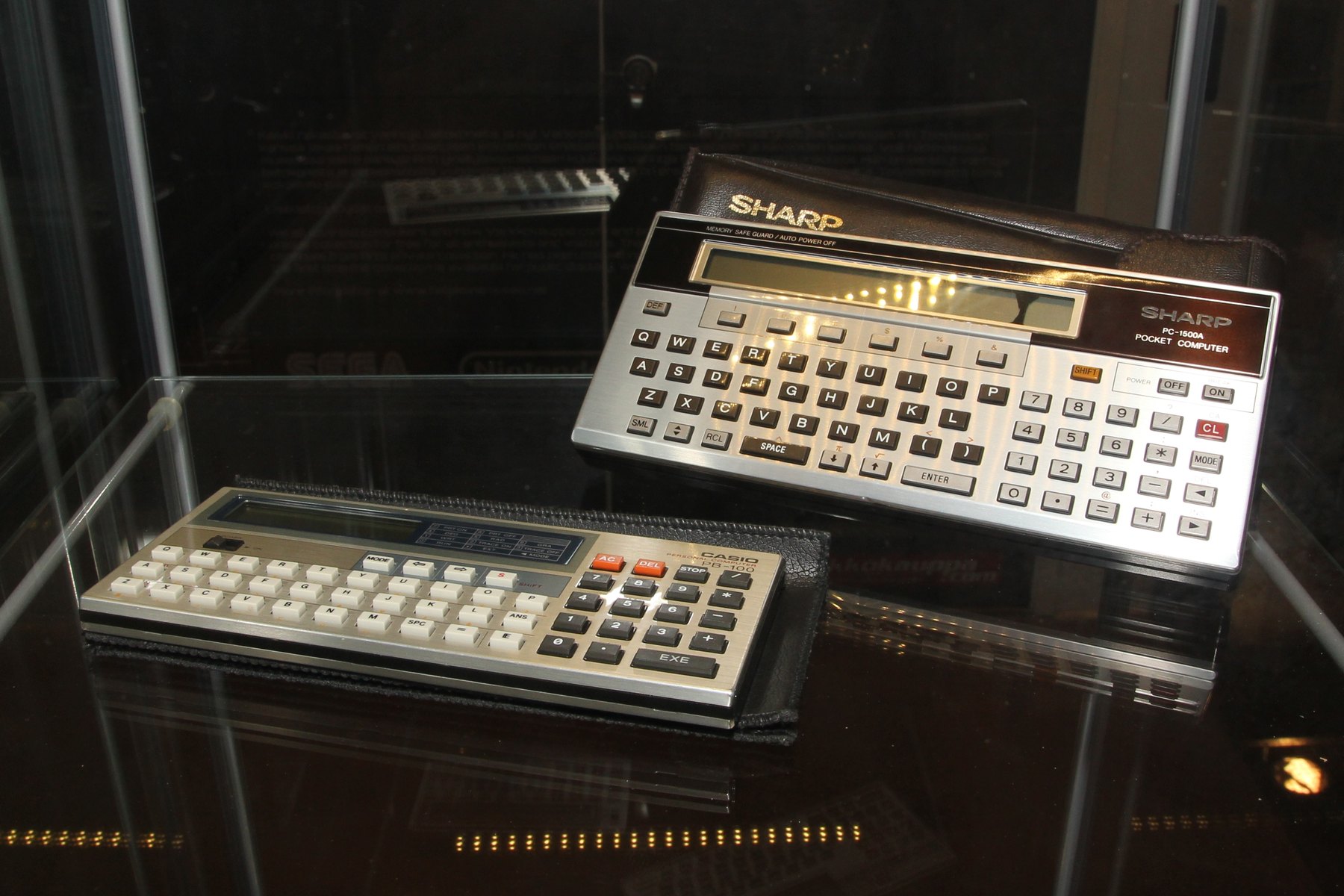 Figure 13 — A Sharp PC-1500A and a Casio PB-100 side by side in a Finnish computer museum.