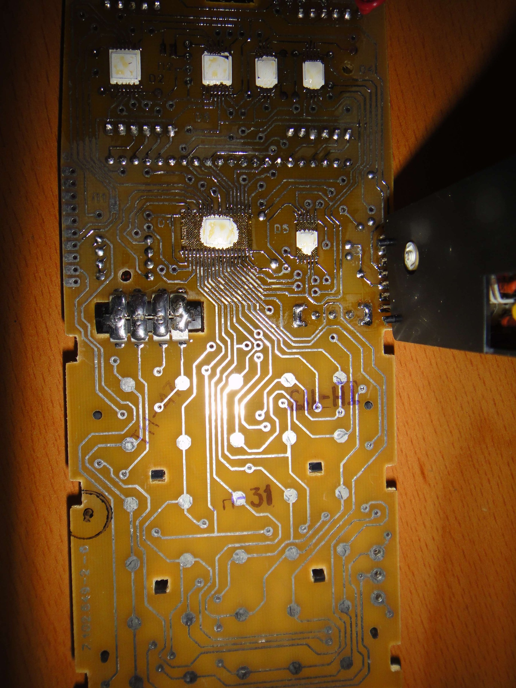 Figure 2 — The back of an MK-61's main board: bare copper tracks and contact pads with no solder mask, which is why the keyboard contacts oxidise.