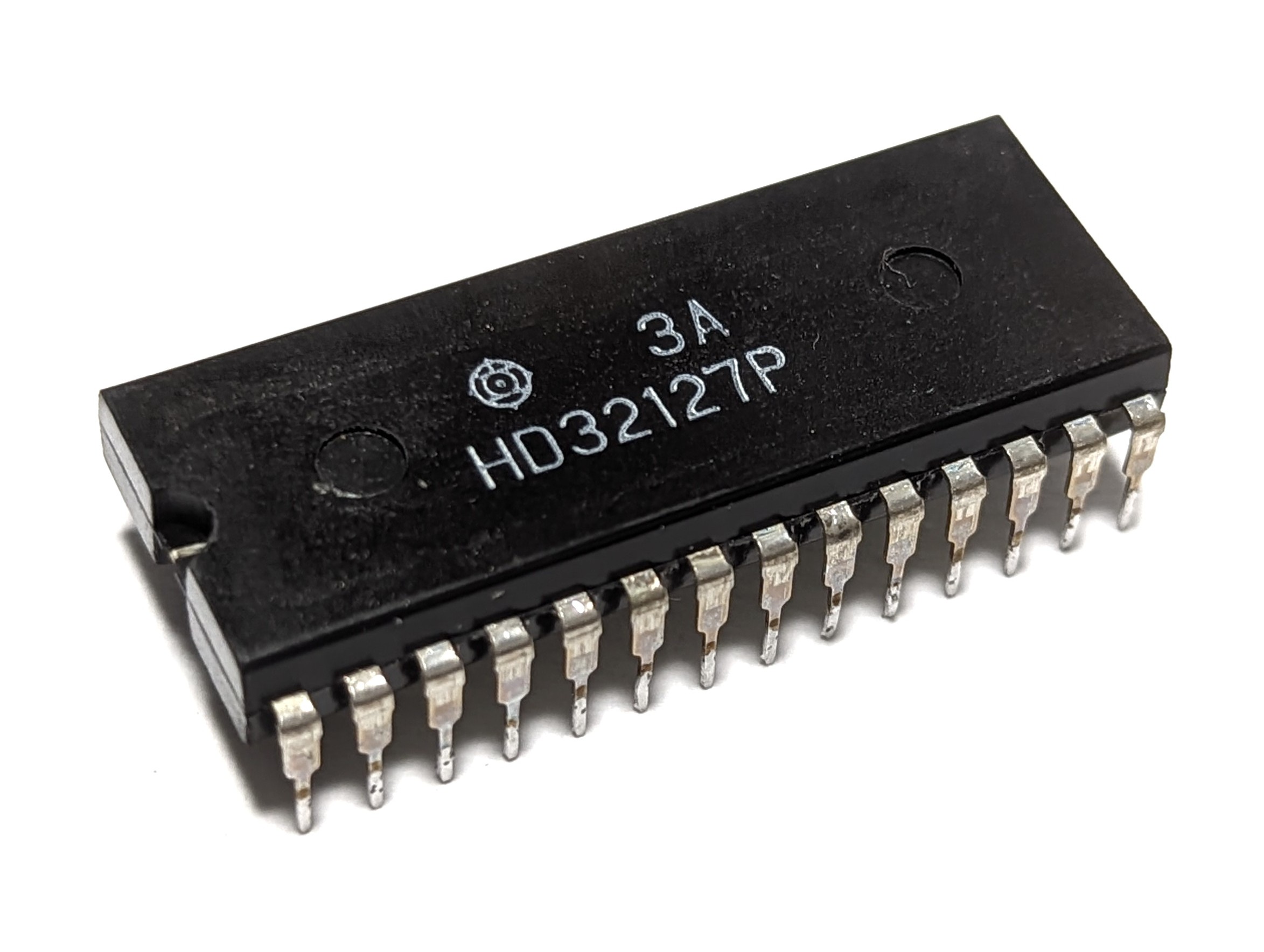 Figure 12 — The Hitachi HD32127P, the single calculator chip of the Casio Mini.
