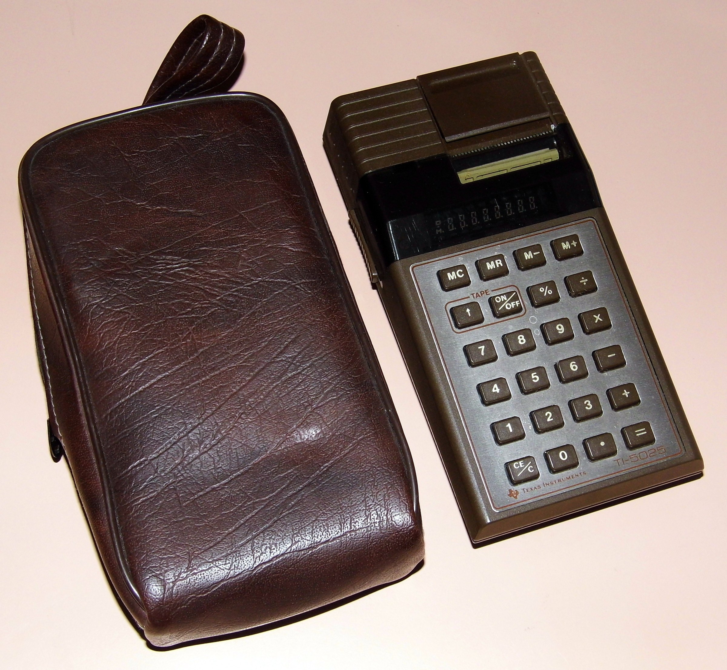 Figure 28 — A Texas Instruments TI-5025 of about 1978: a pocket printing calculator with a fluorescent display, from the company best known for red LED calculators.