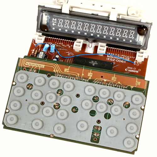 Figure 10 — Inside a Canon L1214 of 1975: the twelve-digit flat fluorescent panel in its holder above the keyboard and the single main board.